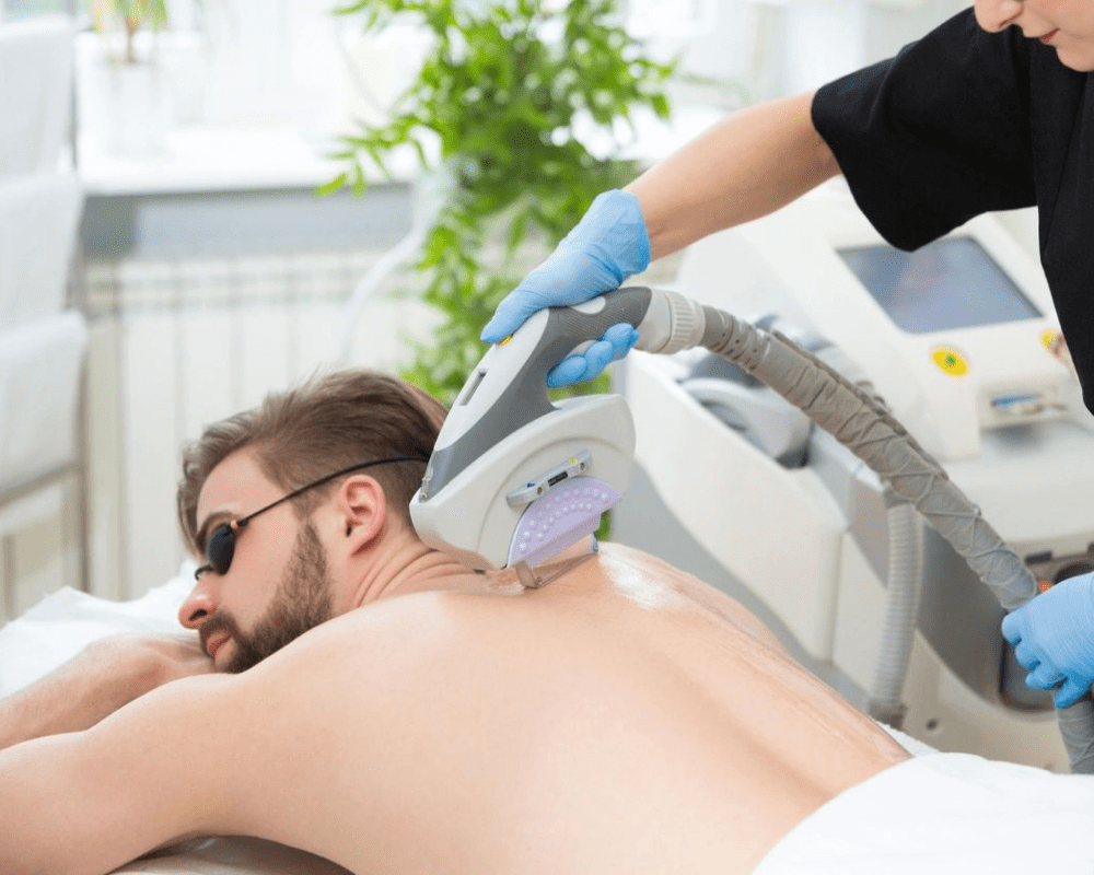 A man getting his back shaved off