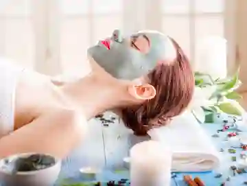 A woman with facial mask on laying down.