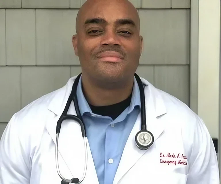 A male doctor wearing a white coat and stethoscope.