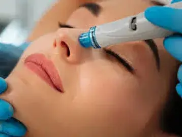 A woman getting her eyes cleaned by an electric device.